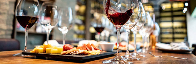 Pouring wine at a tasting room to illustrate Point of Sale.